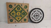 Photo of the square and round vintage double-sided dartboards placed side by side showing the baseball-themed design