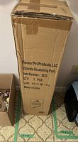 Photo of the unopened cardboard shipping box labeled 'Pioneer Pet Products, LLC Ultimate Scratching Post Item Number 3832'.