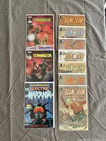 Top view of 3 comics including 2 Terminator comics, Electric Warrior and 4 Shaolin Cowboy issues.