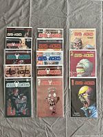 Lot of 13 Deadworld comic books displayed on a gray cloth background in two columns. Covers show varied zombie and horror artwork, with different styles and colors.