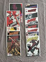 Photo showing all 11 Daredevil comic book covers arranged in two columns, highlighting diversity in cover art styles.