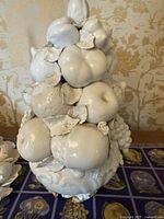 Full view of large white ceramic fruit centerpiece with apples, grapes, pears, and leaves, no chipping.