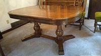 Pecan wood double pedestal dining table base and legs showing turned wood pedestals with cross stretcher support.