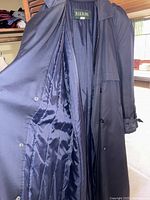 Interior view showing navy blue shiny padded lining and Pier 91 label size 40 regular