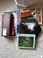 Lot showing Sorry, Othello, wooden box, billiard balls game box, and a puzzle box titled 'A Secret Garden Puzzle'