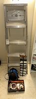 Aluminum 5 step ladder with platform, label 'THIS IS NOT A STEP' visible.
