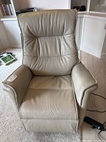 Full front view of grey leather recliner rocker