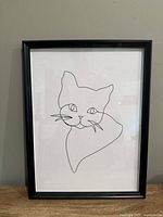 Front view of framed cat line art print