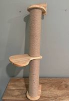 Full view of 34" sisal-wrapped post with wood perch and mounting base