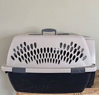 Front view of carrier showing ventilation slots and handle