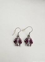 Full view of both earrings showing design and hooks