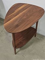 Three-quarter view showing top surface and lower shelf