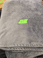 Folded blue fleece blanket showing texture and color