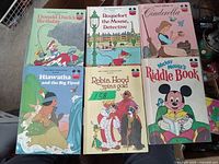 Top view showing all six Walt Disney hardcover children's books with illustrated covers, titles visible