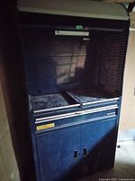 Blue Mastercraft tool box with open top section, pegboard backing, drawers, and cabinet base in good used condition, some surface wear visible.