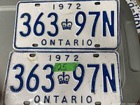 Pair of 1972 Ontario license plates with the number 363 97N and crown symbol, showing signs of usage.