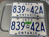 Pair of 1972 Ontario license plates with matching number 839-42A, showing embossed blue characters on white background and some wear.