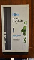 The product packaging showing Blink Video Doorbell branding and usage instructions.