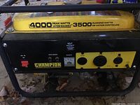 Front view of the Champion generator showing 4000 peak watts and 3500 running watts on yellow top cover, metal frame and lower panel with outlets.