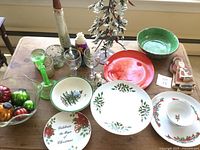 Wide photo showing most items including Spode bowl and plates, vintage balls, various glassware, Christmas tree, wooden Santa figures, and serving bowls
