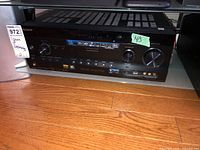 Front view of Sony AV receiver showing model labeling and front control panel.