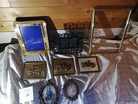 Photo showing all eight frames arranged on cloth showing material types and sizes.