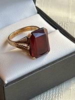Front view of ring in box showing gemstone and band