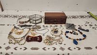 Full lot display showing all jewelry items spread out on a cloth surface