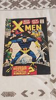 Full cover front of X-Men comic book number 39 showing main artwork and titles.