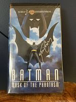 Front cover of the VHS case for Batman: Mask of the Phantasm with Kevin Conroy's autograph.