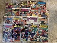 Photo showing all 20 Avengers comic books spread out, displaying colorful Marvel superhero covers.