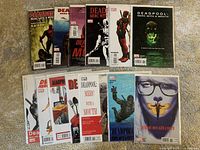 All 13 issues laid out in two rows on a carpeted surface