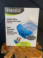 Photo of front side of the unopened box showing product image and brand name.