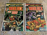 Photo showing two vintage Marvel Strange Tales comics Issues 179 and 181 side by side on a patterned surface.