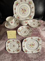 Full set of Royal Albert china pieces showing pattern and layout