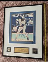 Framed photo featuring Dave Winfield in a batting stance, signed and with plaque indicating 1982 World Series Champions.