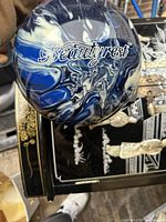 Top view of circular Beautyrest spool showing the marbled blue, white, and black swirl pattern and brand name.