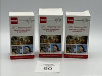 Three sealed RCA OTC Hearing Aid Deluxe Cleaning & Care Kit boxes standing side by side