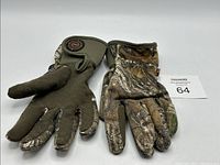 Pair of Manzella bow release gloves, size large, both gloves shown with camouflage pattern, one glove showing circular release mechanism.