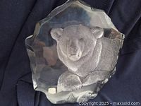 Front view of clear crystal bear figurine showing the etched bear design inside the jagged-edged crystal block.