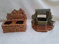 Pair of two vintage McCoy ceramic planters, Wishing Well and Water Wheel on right, and stone wall with foliage planter on left, both brown glazed ceramics.