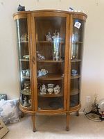 Full front view of solid wood curio cabinet