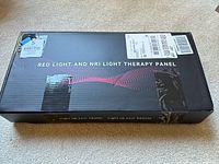 Sealed black box labeled 'Red Light and NRI Light Therapy Panel'.