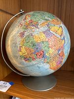 Globe showing continents including Africa, Europe, and part of Asia with detailed country borders and names.