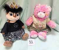 Both plush animals seated side by side showing size and outfits.