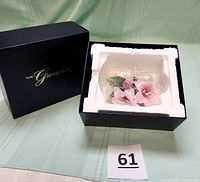 Original Greenbrier black box with figurine secured inside white foam packaging