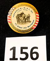 Close-up of the 2 inch round pinback button with patriotic design and fire engine image, showing 'Phoenix H.H.&L. Co. Last Run To Clear the Mortgage' text.