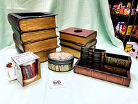 Full set of book-themed office decor items including wastebasket, organizer, tissue holder, mug, and tin on display against fabric background.