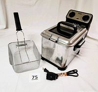 Stainless steel T-Fal Model F33-S deep fryer with a rectangular handled frying basket and power cord displayed on a white background.