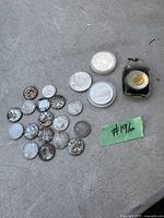 Lot of assorted Canadian coins including many rusty nickel 5 cents and more collectible coins in plastic cases with one coin in a keychain.